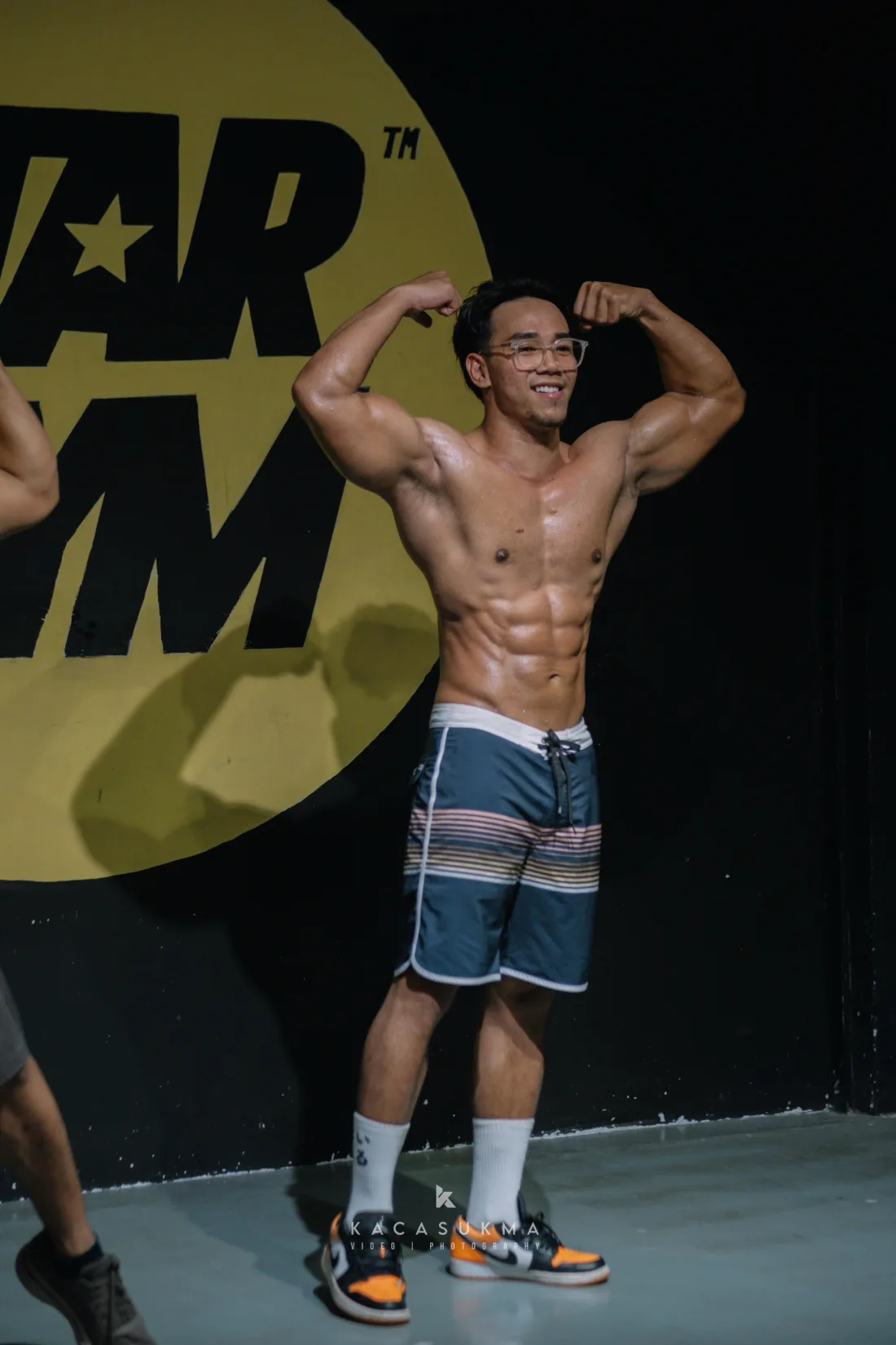 Competitor posing confidently on stage